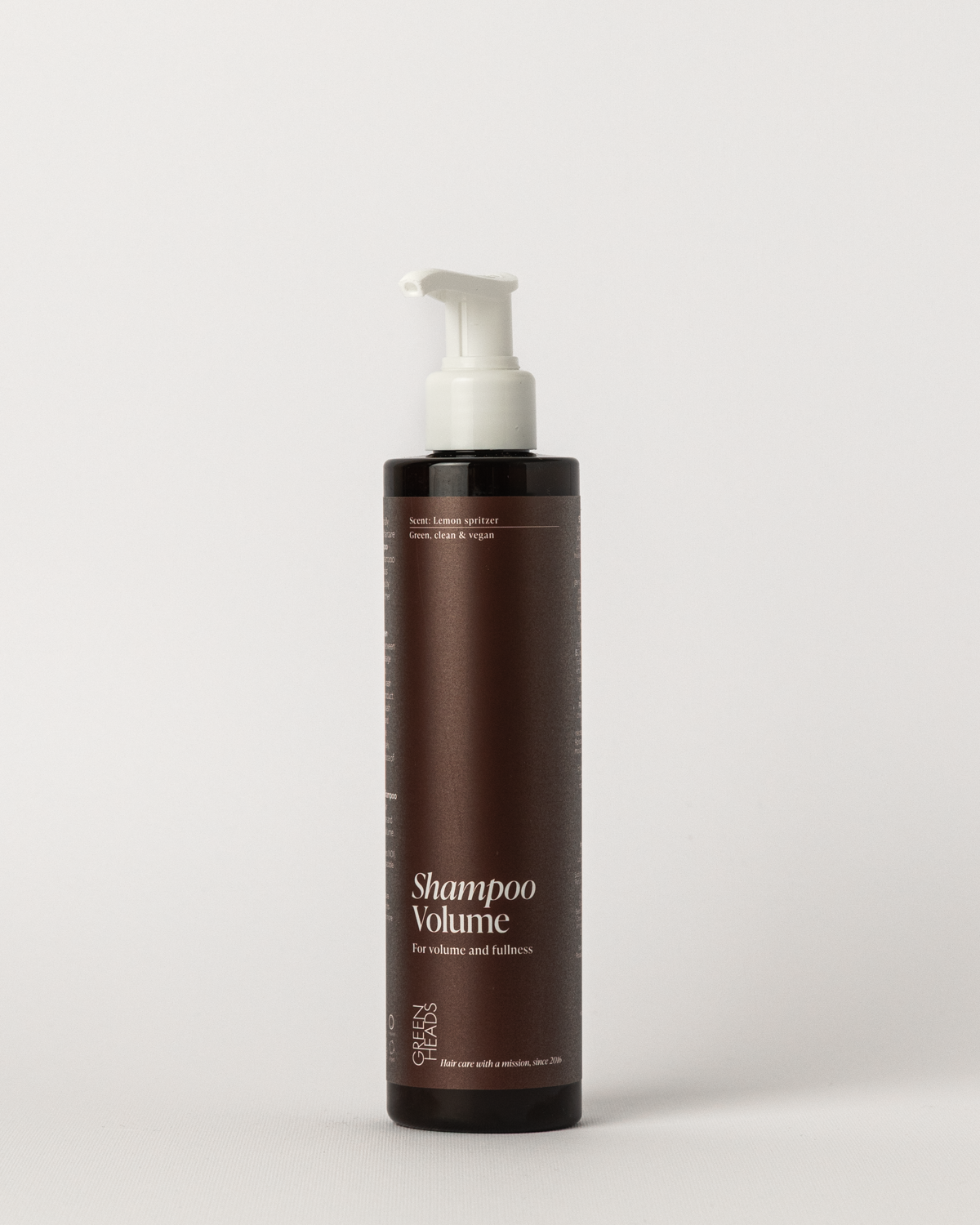 Green Heads Shampoo Volume vloeibaar, 250 ml pompfles met bordeauxrood label op witte achtergrond